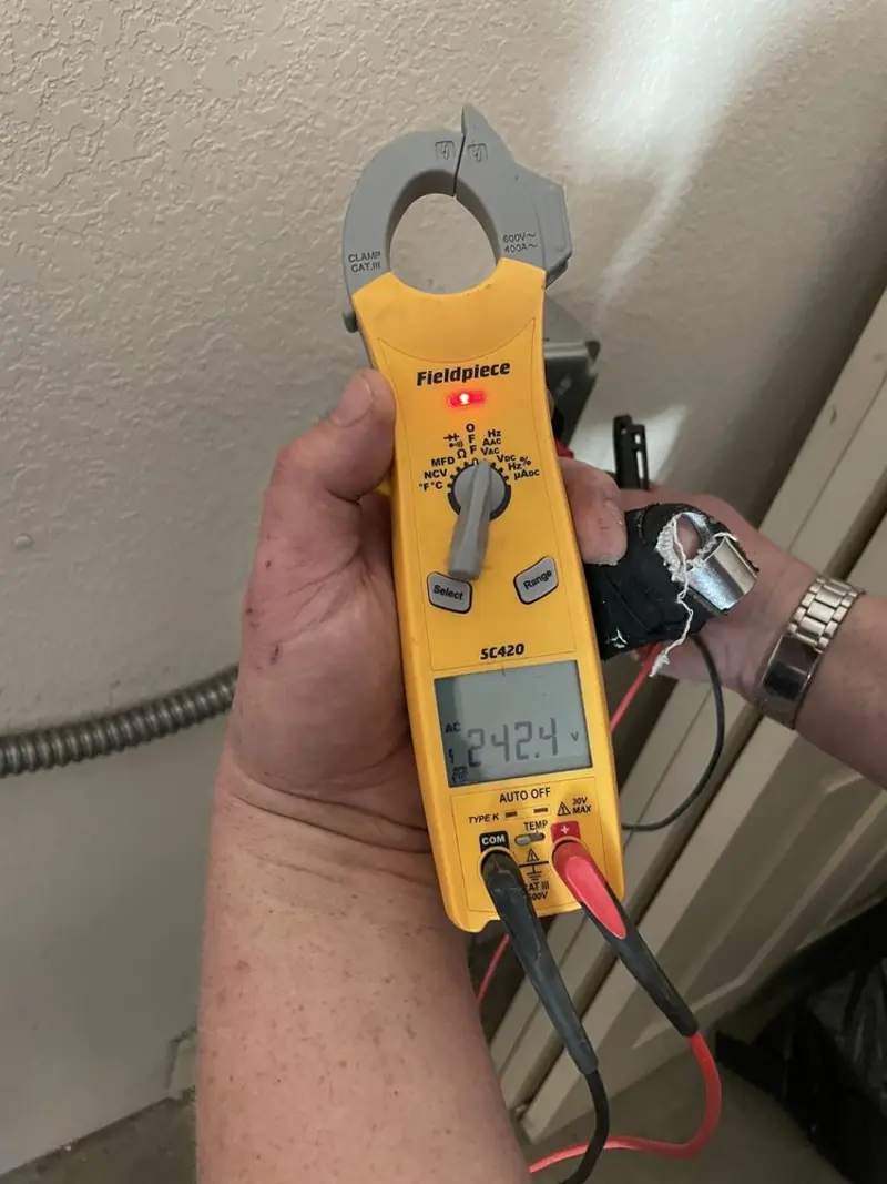 Voltage testing with clamp meter during Electrical Installation Services in East Point